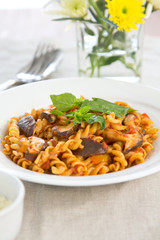 Fusili with mushroom in tomato sauce