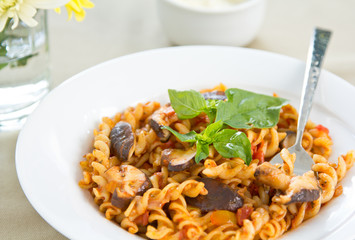 Fusili with mushroom in tomato sauce