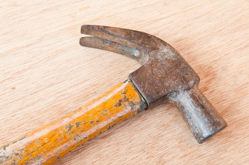 old hammer on wood background