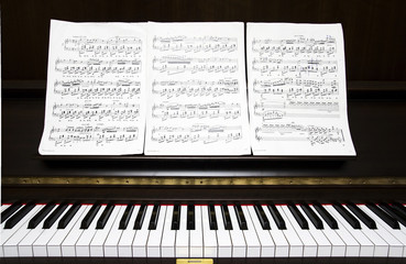 piano keyboard and sheet music