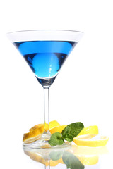 Blue cocktail in martini glass isolated on white