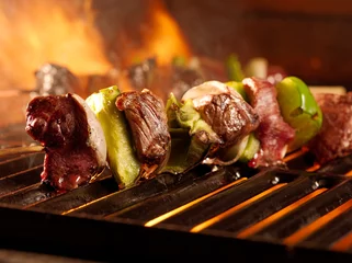 Tuinposter beef shishkababs on the grill © Joshua Resnick