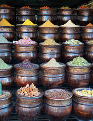Traditional baskets of colorful spices in shop