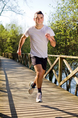 Young healthy man running at the park