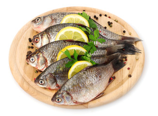Fresh fishes with lemon, parsley and spice