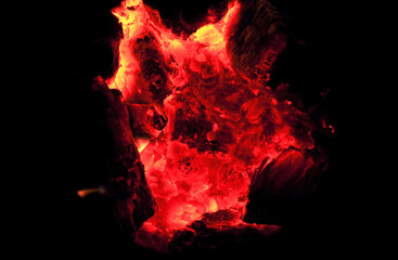 close up on burning charcoal in kitchen stove