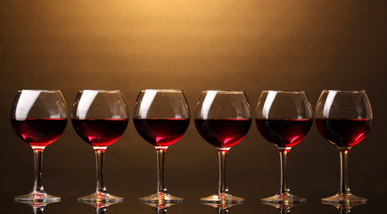 Wineglasses on brown background