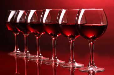 Wineglasses on red background
