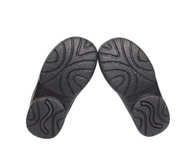 soles of child's black shoes