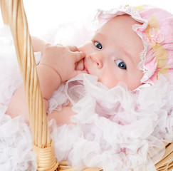 baby in a wicker basket