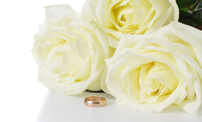 White roses and wedding ring