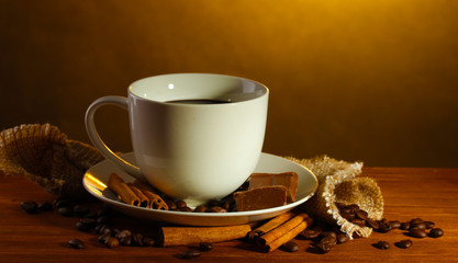 cup of coffee and beans, cinnamon sticks and chocolate