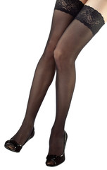 Beautiful legs of young woman wearing black stockings