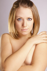Obraz premium young sexy woman with blue eyes posing in the studio