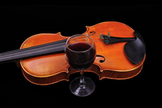 Violine and wine isolated on black