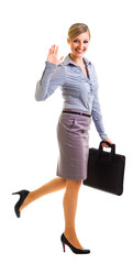 Happy businesswoman with briefcase isolated on white