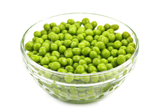 Preserved peas in glasses bowl isolated