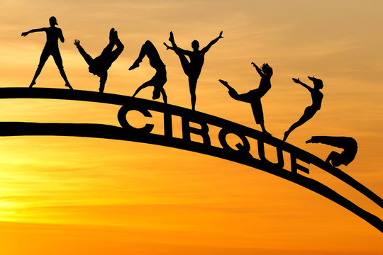 silhouette of circus artists