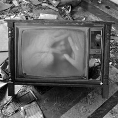 ghostly figure on vintage tv set