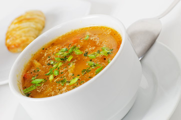 Fresh fish soup on white background