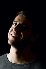 smiling man in the darkness