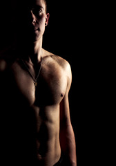 Fototapeta na wymiar silhouette of a beautiful male body sport relief