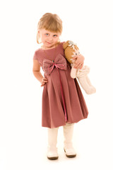 Portrait of happy little girl with a doll