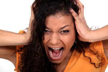Portrait of a young woman screaming