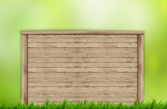 Wooden billboard on beautiful green grass