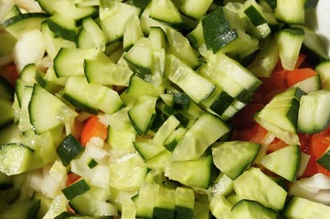 Summer salad with cucumber, tomato, onion and cabbage