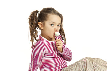 Close-up of  little girl with a lollipop, isolated on white © alexandre zveiger