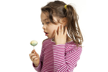 portrait of  little girl with a lollipop, isolated on white © alexandre zveiger
