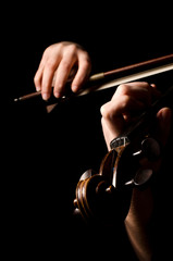 Female hands play a violin on the black © Vladimir Voronin