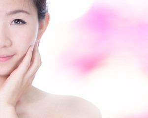 Obraz premium Woman Half smile Face and hand touch face