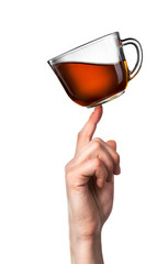 Tea cup balanced on finger isolated on white