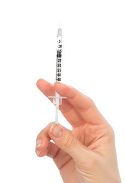 Doctor hand with medical insulin syringe in hand