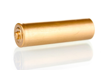 Golden battery isolated on white