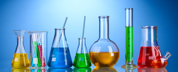 Different laboratory glassware with color liquid and with