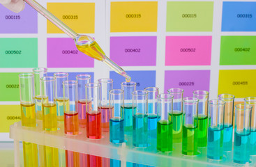 Test-tubes with color liquid and pipette