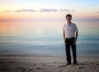 Attractive man on a beach with sunset / sunrise (Maldives)
