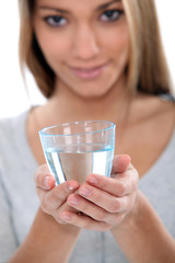 Woman holding glass of water