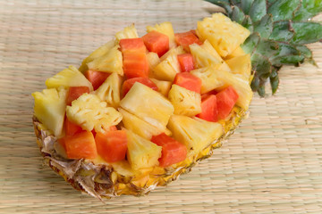 Fresh cut pineapple served in a natural bowl