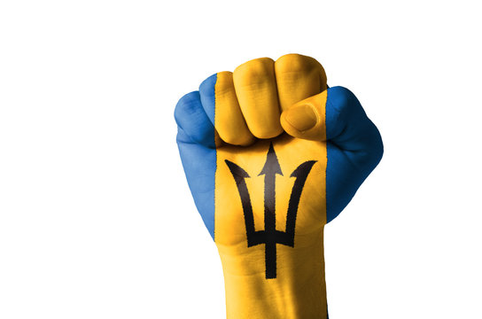 Fist painted in colors of barbados flag