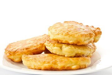 fried fritters on a white plate