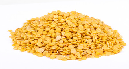 Yellow lentils isolated on white background.Macro shot