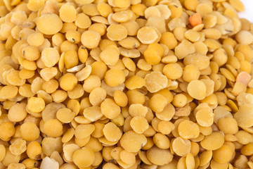 Yellow lentils isolated on white background.Macro shot