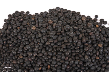 Heap of black lentil isolated on white