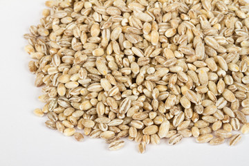 Pearl barley heap isolated on white
