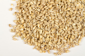 Pearl barley heap isolated on white