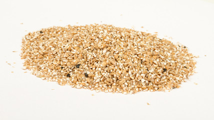 Pearl barley heap isolated on white